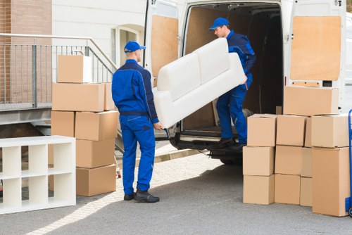 Professional business relocation setup with labelled boxes and furniture