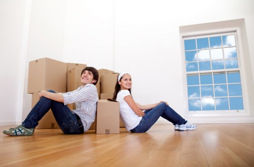 Office relocation equipment and desks being moved locally