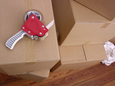 Packed office boxes and labelled equipment ready for Croftonpark relocation